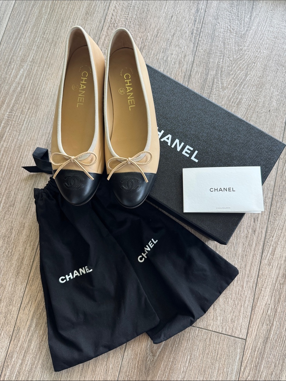 CHANEL Beige and Black Two-Tone Cap-Toe Ballet Flats